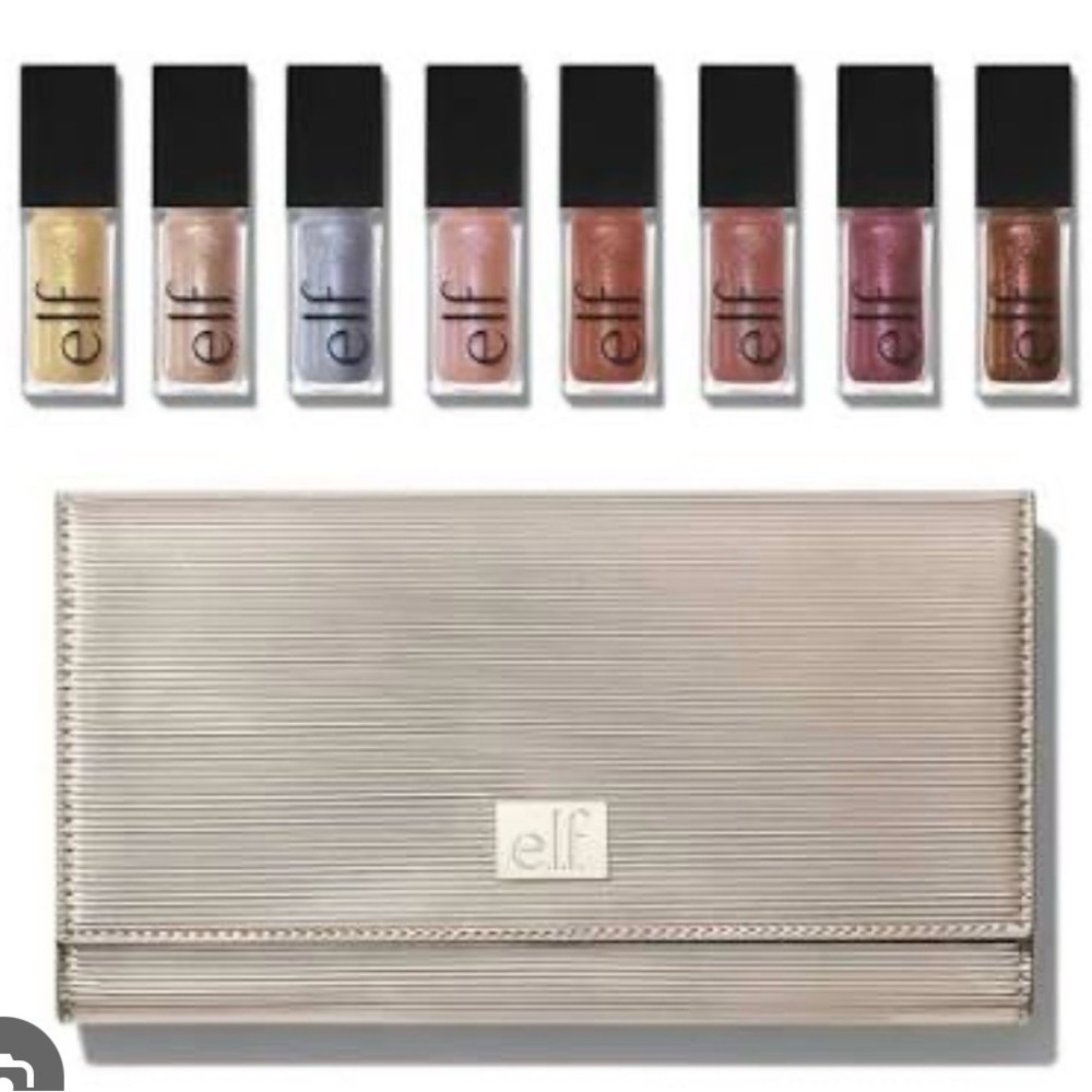 e.l.f. Cosmetics clutch w 8 sealed lip glosses.Opened to take pics.NEW! SOLD OUT